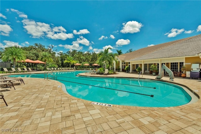 view of swimming pool featuring a patio area