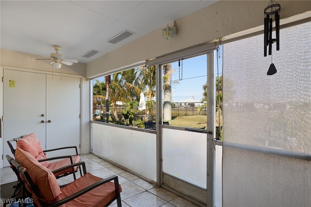 sunroom / solarium with ceiling fan