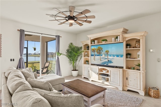 tiled living room featuring ceiling fan