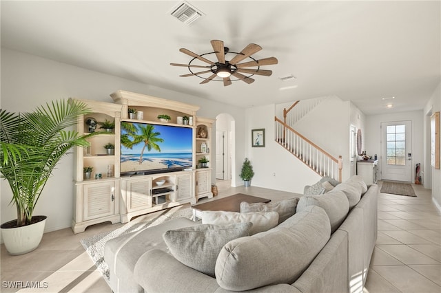 living room featuring ceiling fan and light tile patterned flooring