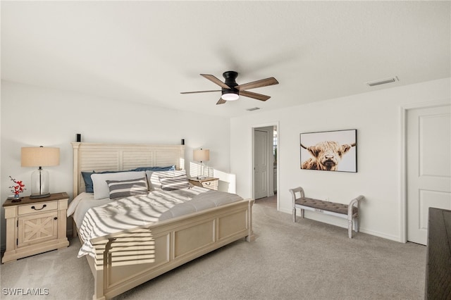 bedroom featuring light carpet and ceiling fan