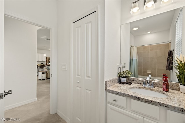 bathroom featuring vanity, tile patterned floors, and curtained shower