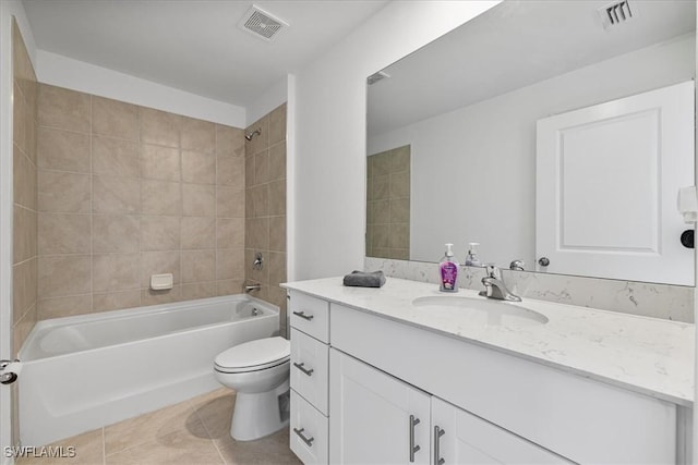 full bathroom with tile patterned flooring, vanity, toilet, and tiled shower / bath