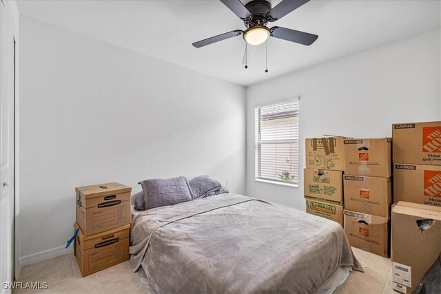 bedroom featuring ceiling fan and light tile patterned floors