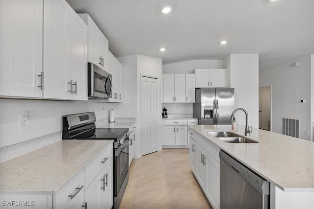 kitchen featuring white cabinets, appliances with stainless steel finishes, and sink