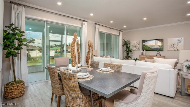 dining space featuring crown molding