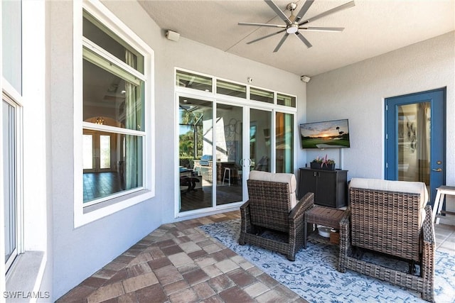 view of patio featuring ceiling fan