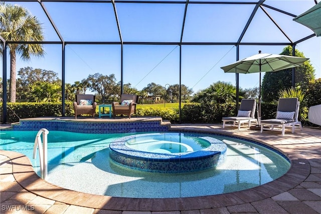 view of swimming pool with a patio area, a lanai, and an in ground hot tub