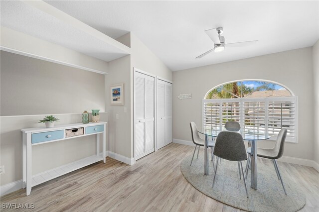 13120 Castle Harbour Dr Unit N4, Naples, FL 34110 - dining room with light wood-type flooring, a ceiling fan, baseboards, and lofted ceiling
