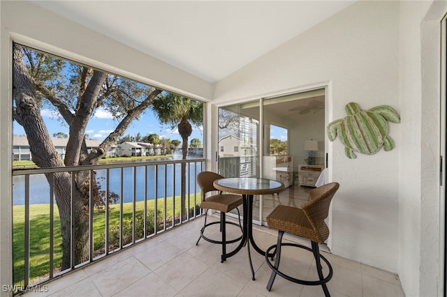13120 Castle Harbour Dr Unit N4, Naples, FL 34110 - sunroom / solarium with a water view, lofted ceiling, and tile patterned flooring