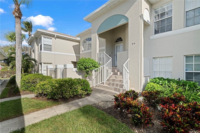 13120 Castle Harbour Dr Unit N4, Naples, FL 34110 - property entrance featuring stucco siding