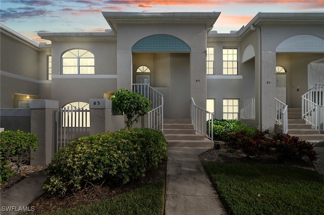 13120 Castle Harbour Dr Unit N4, Naples, FL 34110 - view of exterior entry with stucco siding