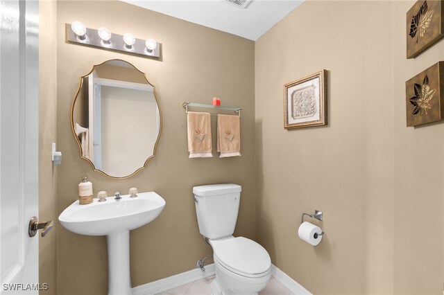 bathroom with toilet and sink