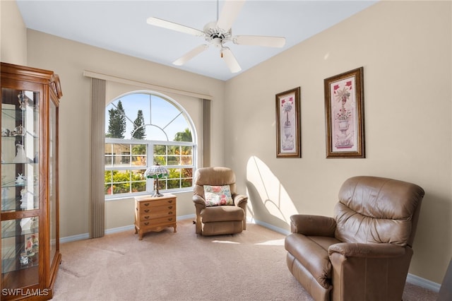 living area featuring ceiling fan and carpet floors