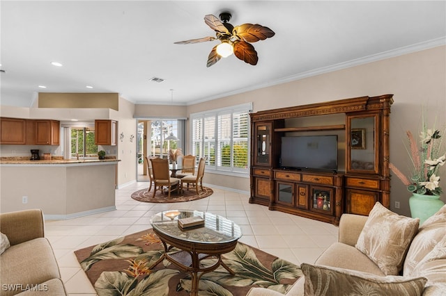 tiled living room with crown molding and ceiling fan