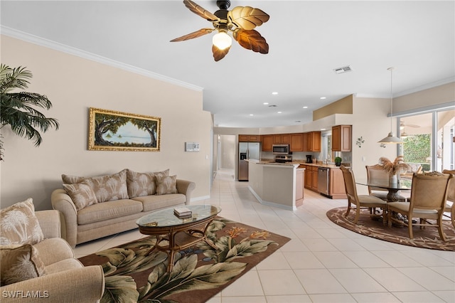 living room with light tile patterned flooring, ceiling fan, and ornamental molding