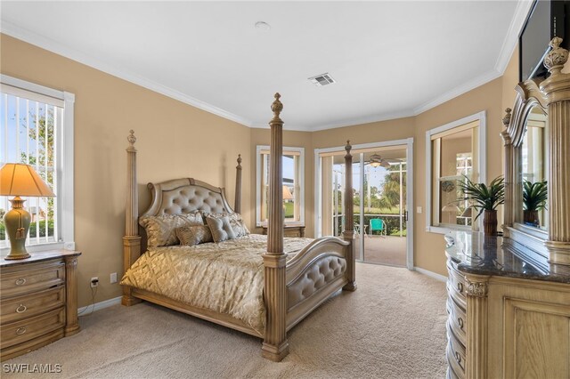 carpeted bedroom with access to exterior, ornamental molding, and multiple windows