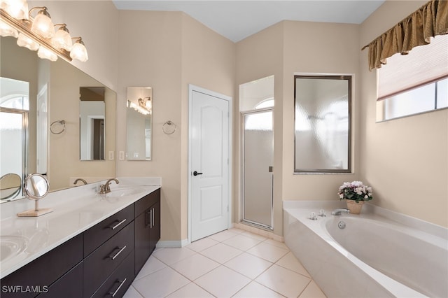 bathroom featuring tile patterned flooring, plus walk in shower, and vanity