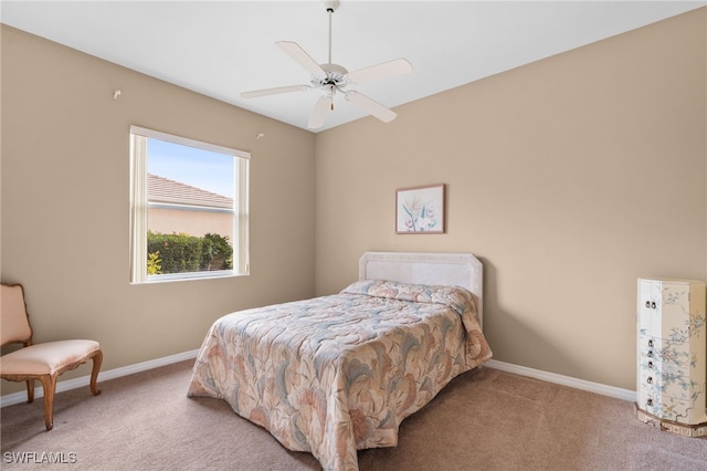 bedroom with ceiling fan and carpet