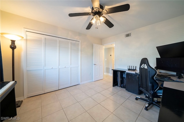 tiled home office with ceiling fan