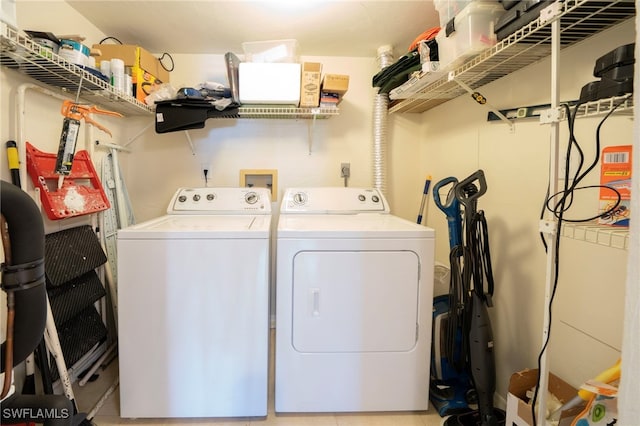 laundry room featuring washing machine and clothes dryer