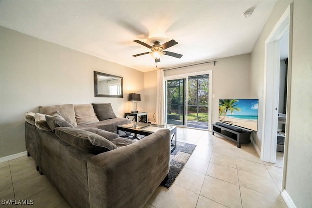 tiled living room featuring ceiling fan