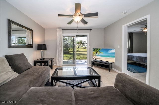 tiled living room featuring ceiling fan