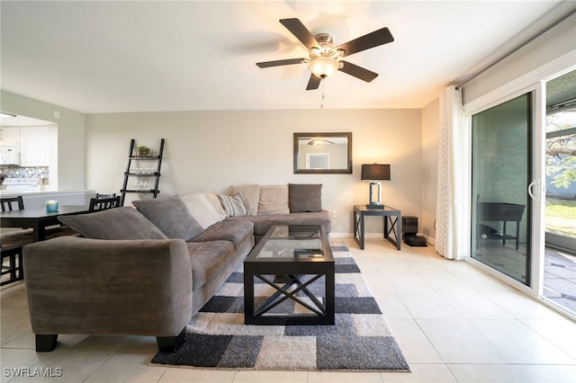 tiled living room with ceiling fan