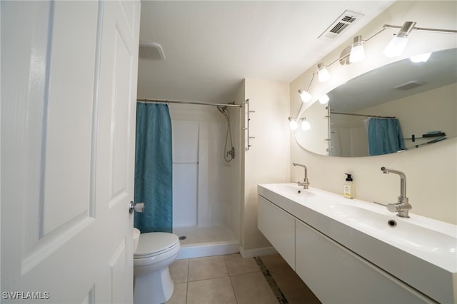 bathroom with toilet, vanity, tile patterned floors, and curtained shower