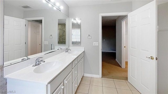 bathroom with tile patterned floors and vanity