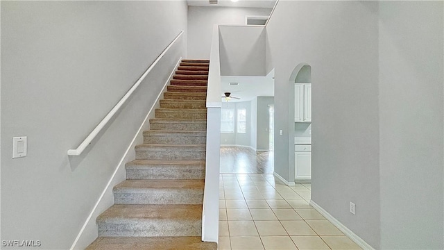 stairway featuring tile patterned floors