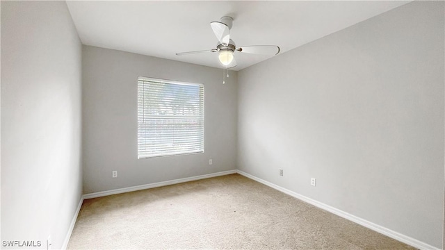 carpeted empty room with ceiling fan