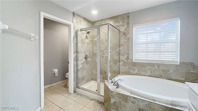 bathroom featuring separate shower and tub, tile patterned flooring, and toilet