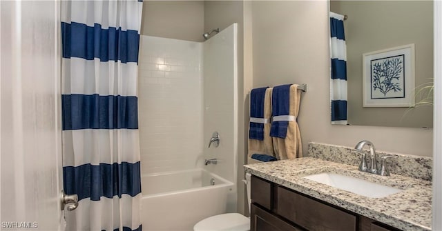 full bathroom with shower / bath combination with curtain, vanity, and toilet