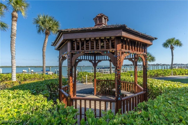 view of property's community featuring a gazebo and a water view