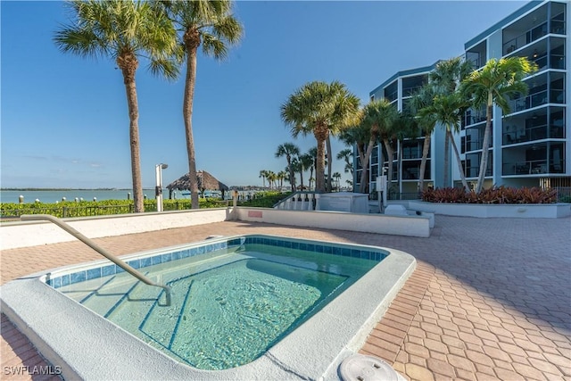 view of pool featuring a water view