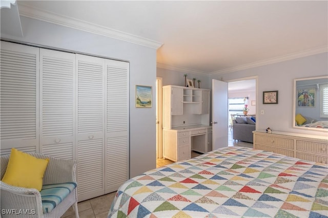 tiled bedroom featuring crown molding and a closet