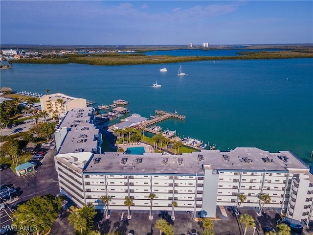 birds eye view of property with a water view