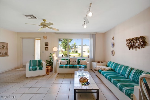 tiled living room featuring ceiling fan