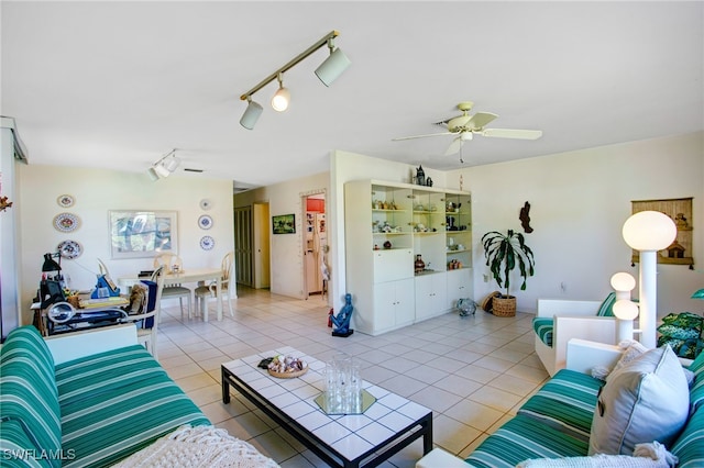 tiled living room with track lighting and ceiling fan