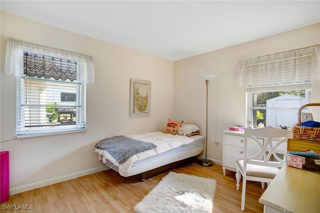 bedroom with hardwood / wood-style flooring