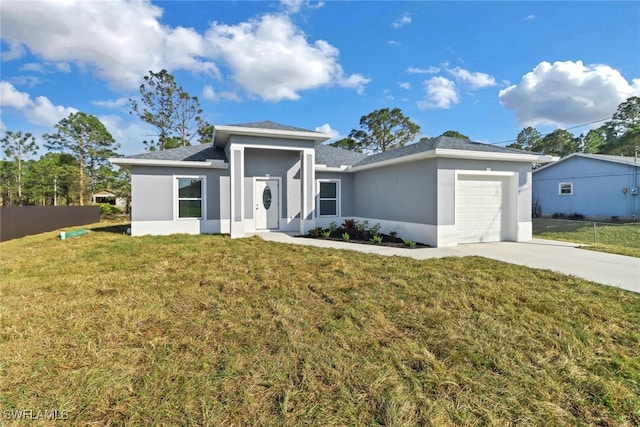 view of front of house with a garage and a front yard