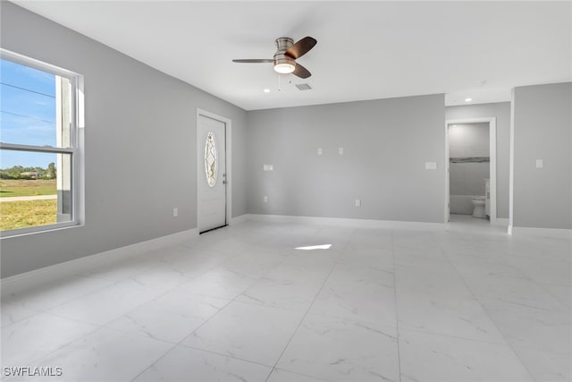 empty room with recessed lighting, a ceiling fan, visible vents, baseboards, and marble finish floor