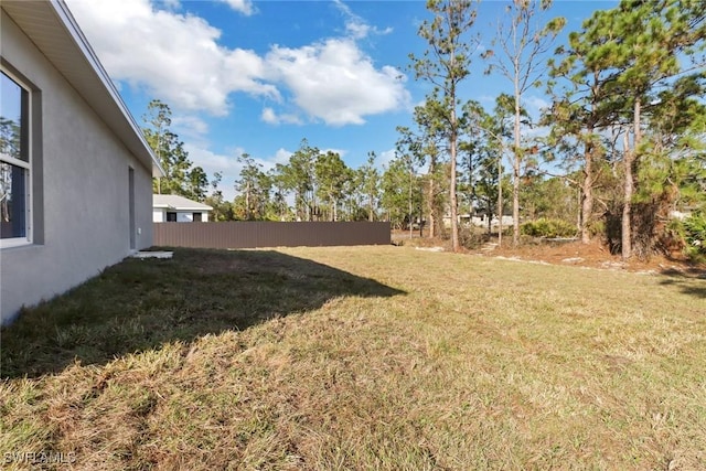 view of yard with fence