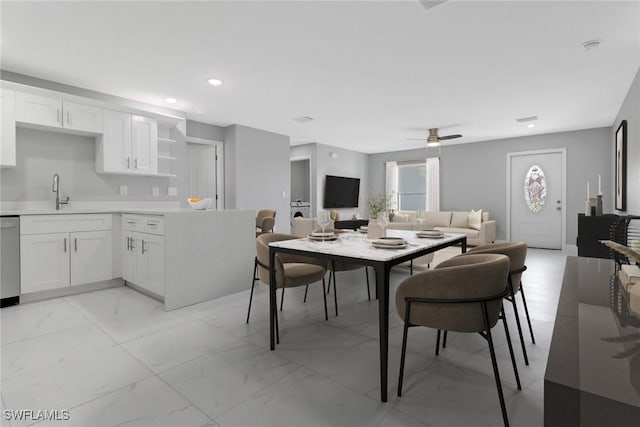 dining area featuring marble finish floor, a ceiling fan, and recessed lighting