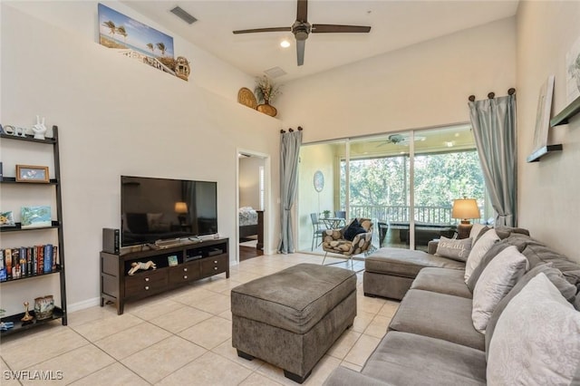 living room featuring ceiling fan and light tile patterned floors