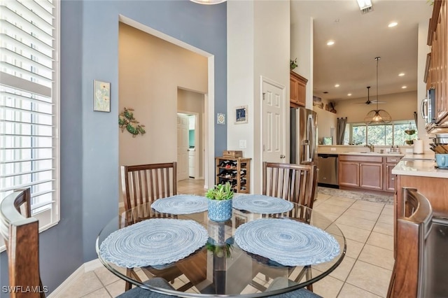 tiled dining space featuring sink