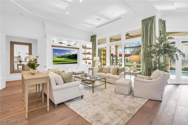 living room featuring french doors, hardwood / wood-style flooring, ceiling fan, and ornamental molding