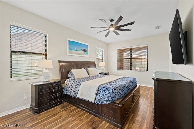 bedroom featuring ceiling fan and dark wood-type flooring