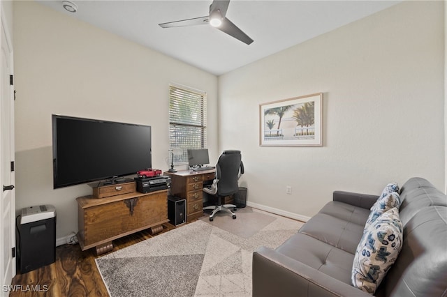 office with wood-type flooring and ceiling fan